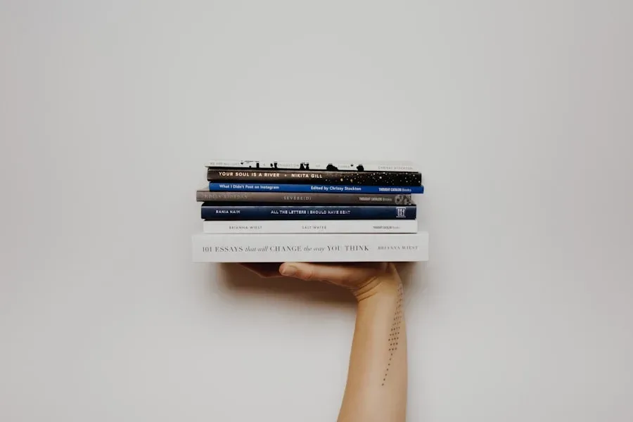 A close-up of an open paperback book against a soft cream background.